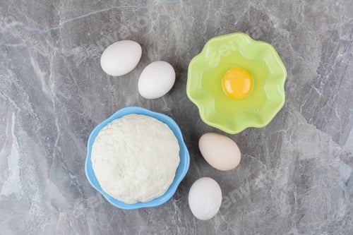 Preview: A green plate of raw egg and chicken eggs