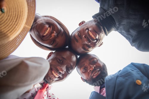 Preview: Group of african friends do head to head and smile together, happiness and friendship