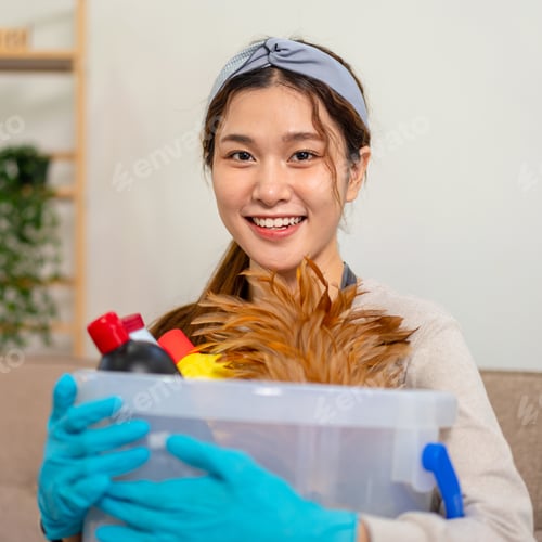 Preview: Housekeeper is wearing protective gloves to holding bucket of cleanser bottle and feather duster