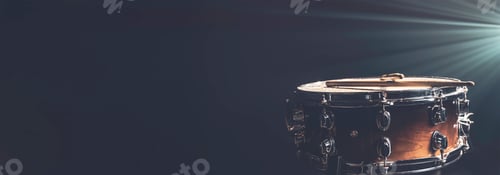 Preview: Snare drum on a dark background isolated with space for a text.