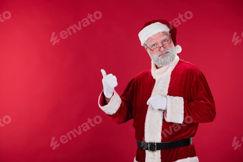 Preview: Portrait of Wise Elder Santa Claus Giving Thumb Up Gesture