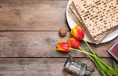 Preview: Flat lay composition with symbolic Pesach (Passover Seder) items on wooden table, space for text