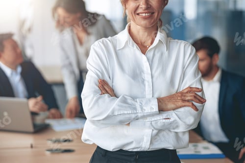 Preview: Close up of Portrait of confident business woman looking straight with her team at background
