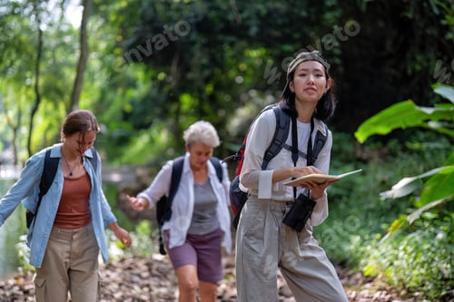 Preview: Backpack tourist travel outdoor adventure bird study using binoculars looking and record to book