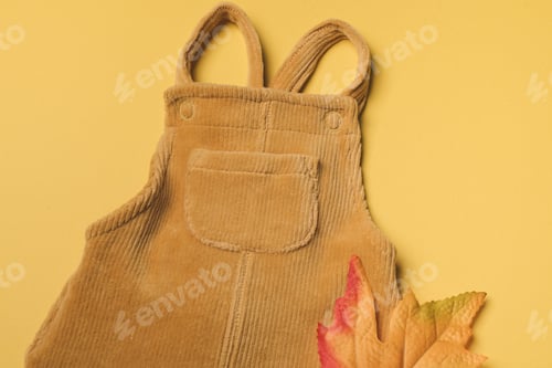 Preview: Mustard baby romper, yellow autumn leaves on orange background. Set of baby clothes
