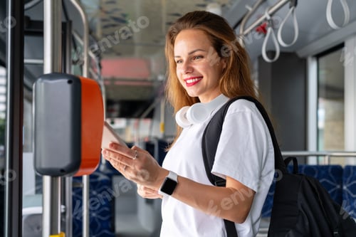 Preview: Urban woman passenger of city public transportation paying bus by her smart phone.