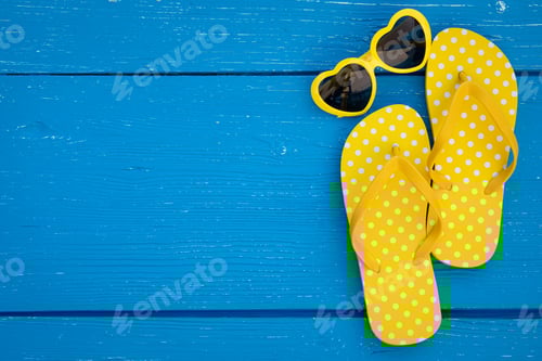Preview: Beach flip-flops on blue wooden background