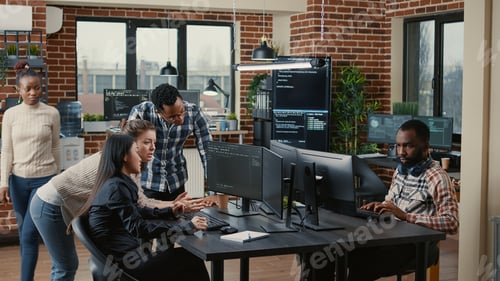 Preview: Junior dev programmers collaborating on group project compiling algorithm asking senior developer
