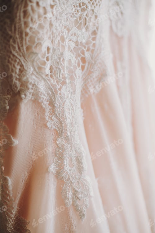 Preview: Luxury modern wedding dress hanging at window