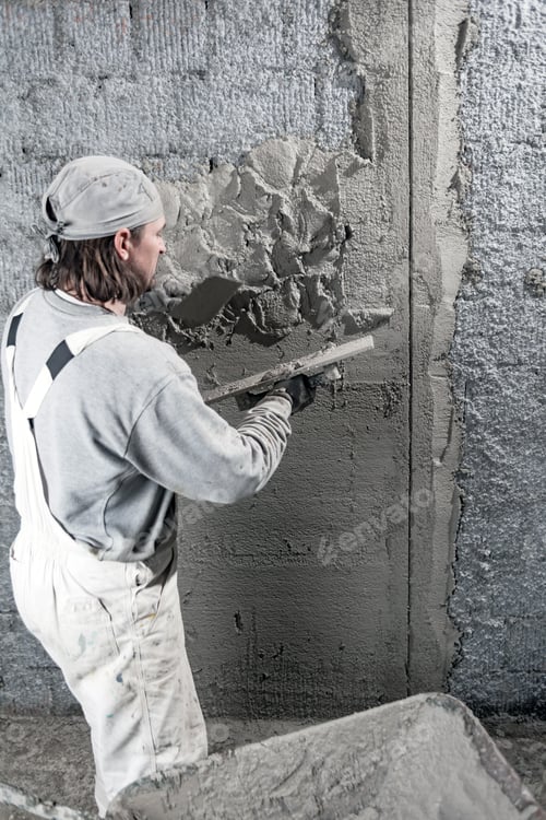 Preview: Real Construction Worker Working On A Wall Inside The New House.