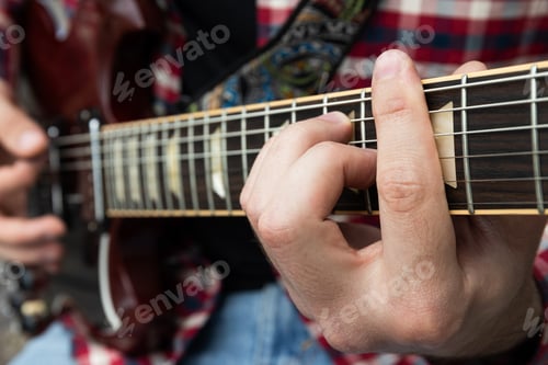 Preview: A man plays a beautiful guitar close-up