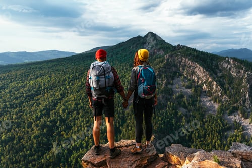 Preview: A couple in love on a rock admires the beautiful views