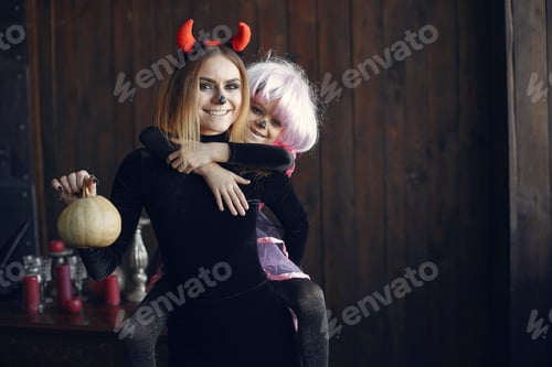 Preview: Mother with daughter in a halloween costume and makeup