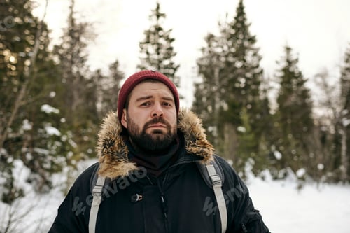 Preview: Bearded Man with Backpack in Winter Woods
