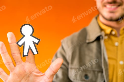 Preview: Smiling man holding funny paper toy