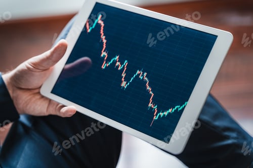 Preview: Businessman,investor,trader analyzing,looking at chart of stock exchange price in tablet.CEO,manager