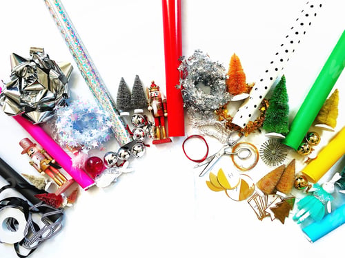 Colorful Christmas Decorations and Wrapping Supplies on White