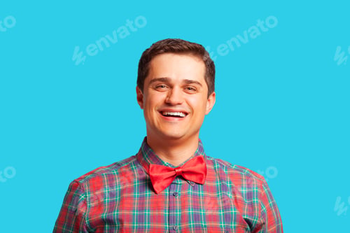 Preview: Casual man in shirt on blue background.