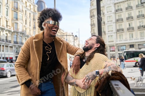 Preview: Gay couple laughing together on city street