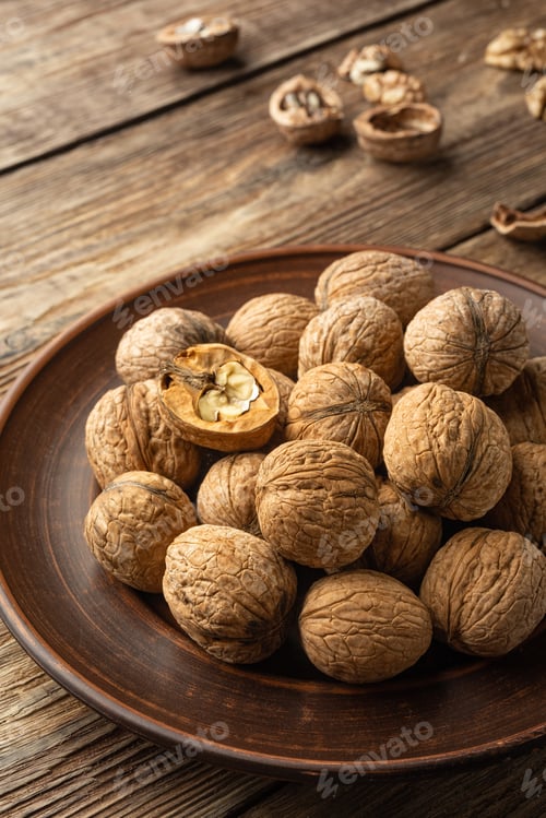 Preview: Nuts. Walnut kernels and whole walnuts.