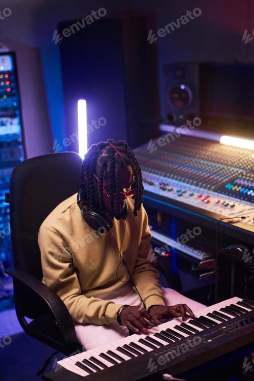 Preview: Man playing piano and writing new music