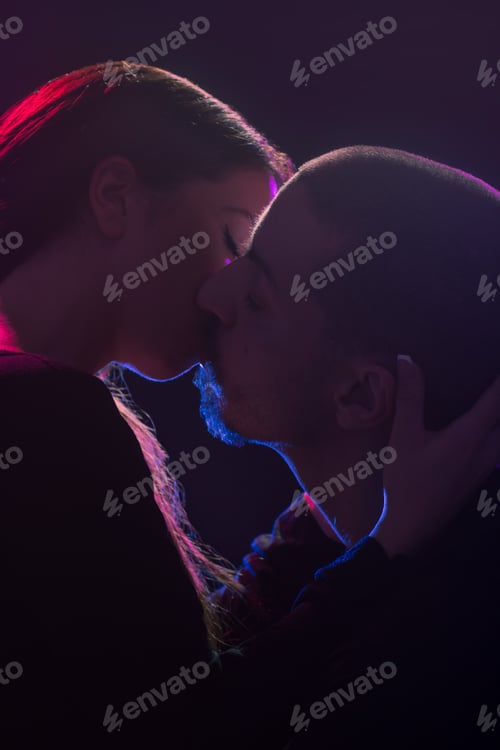 Preview: Young Adult Caucasian, Straight (Heterosexual) Couple Sensual Kissing. Black Background, Studio