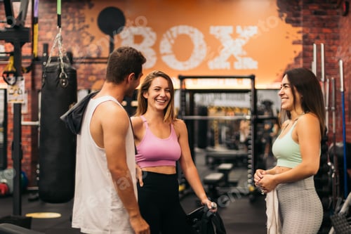 Preview: friends talking and having fun in the gym while they are resting