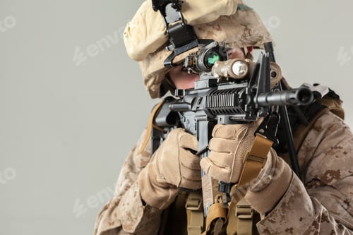 Preview: Soldier aims rifle while wearing tactical gear in indoor setting during training exercise