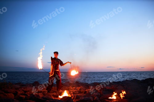 Preview: Male Fire Show Performer Dancing with Flaming Poi
