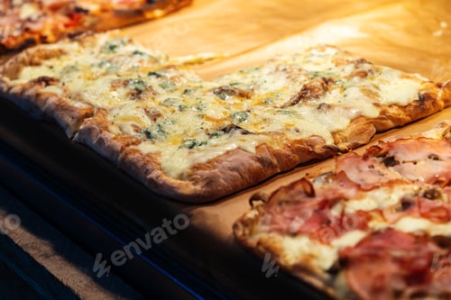 Preview: Pizza pieces to go on a stall in pizzeria