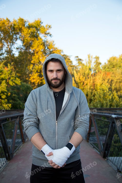 Preview: portrait of bearded Caucasian man in outdoor hooded sportswear