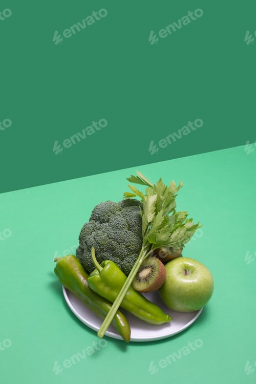 Preview: Fresh green vegetables and fruits on green table