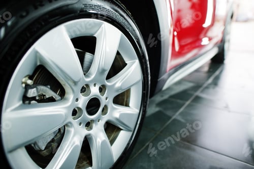 Preview: View of car tires at garage.