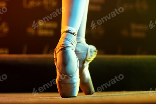 Preview: Shallow focus shot of the ballet dancer's feet standing on tiptoe