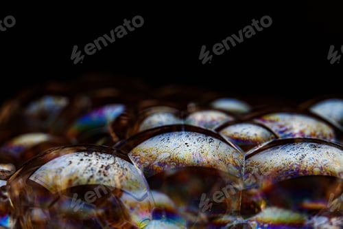 Preview: Rainbow soap bubble on a black background.