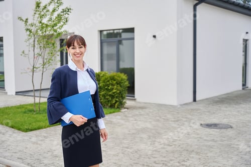 Preview: Lady has a blue folder with documents in her hands