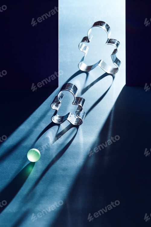 Preview: Cookie cutters with shadow lighting. Symbolic images of a person on the border of light and darkness