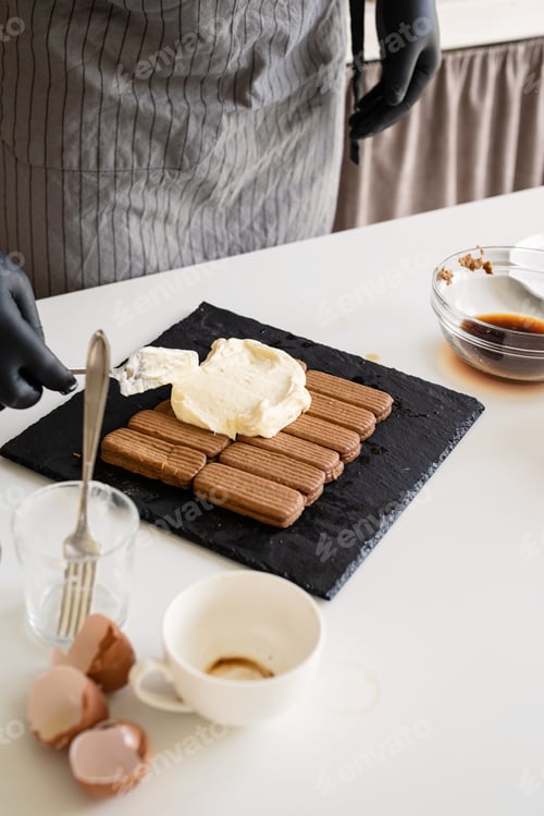 Preview: Cooking a homemade tiramisu cake high angle view