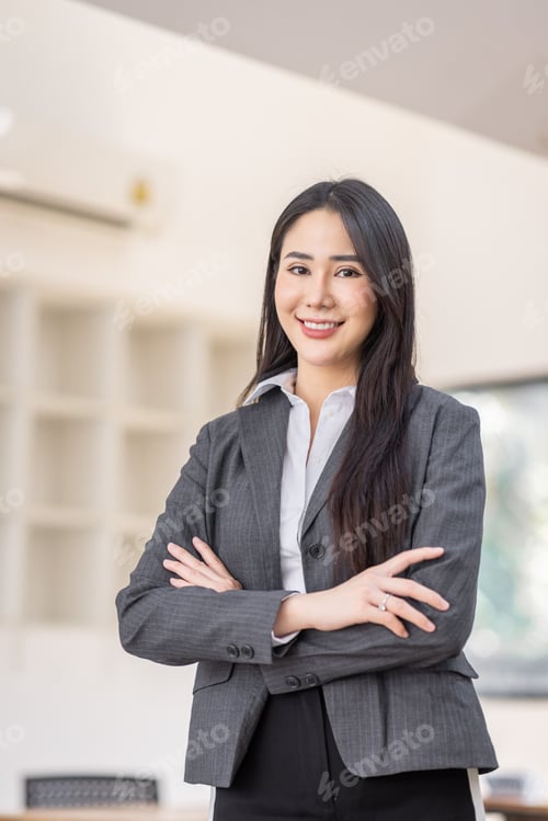 Preview: Portrait of successful business asian women in suit with arms crossed and smile isolated over white