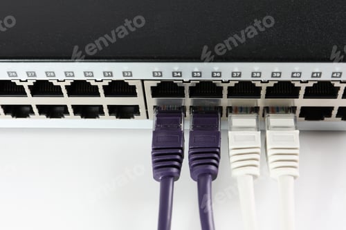 Preview: Closeup view of network switch with cables on light background. Internet connection