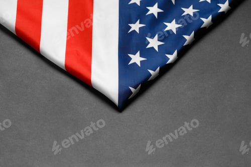 Preview: American flag on a black background, top view, copy space. Symbol of independence, patriotism.