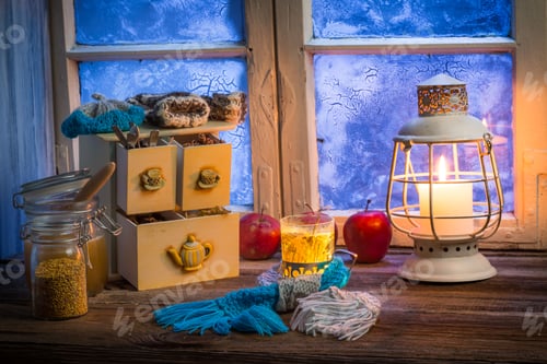 Preview: Warming tea in a winter cottage on old wooden table