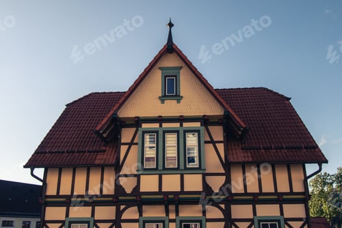 Preview: Low angle shot of a half-timbered style building during October