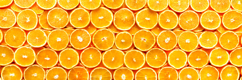 Preview: Fresh sliced orange fruit texture. Macro, top view, copy space, banner. Food frame. Juicy oranges