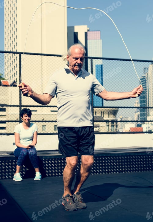 Preview: People exercising at fitness gym