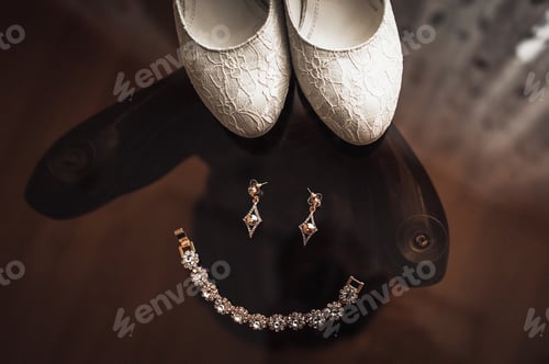 Preview: Wedding attributes such as earrings, necklace, shoes. Tender beige shoes and earrings