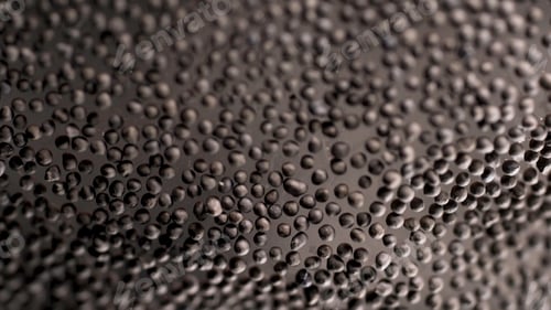Preview: Black peppercorn background, grains lying on glass surface. Stock footage. Close up of black pepper