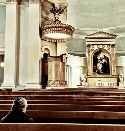 Preview: Prayer inside Helsinki Cathedral, Finland.