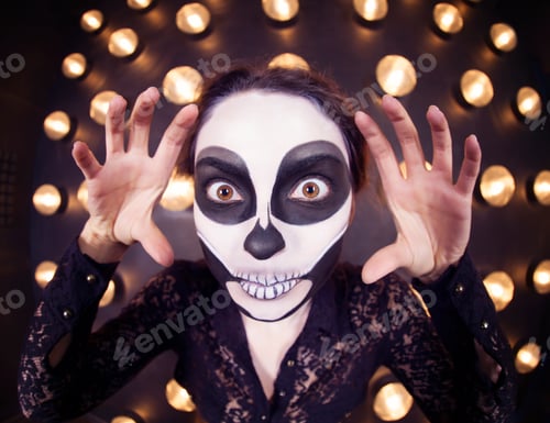 Vista previa: Beautiful woman painted as skeleton. Halloween theme