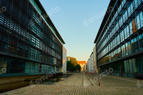 Preview: Glass facades of contemporary office buildings at sunset